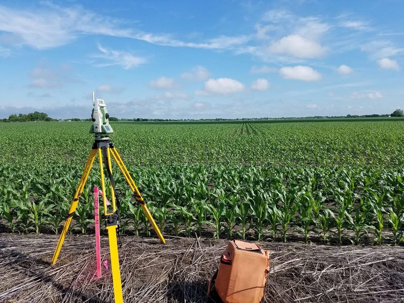 Survey setup beside a corn field